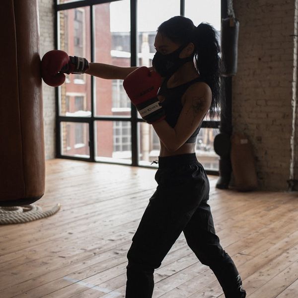 Athlete in a state of calm focus during a workout, with neon accents.